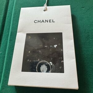 Chanel Black Button with Lions head, rhinestones and CC Logo.
